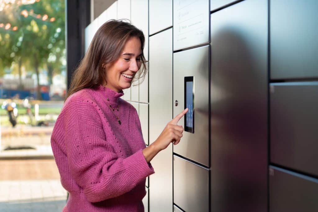 Person using a smart workplace locker